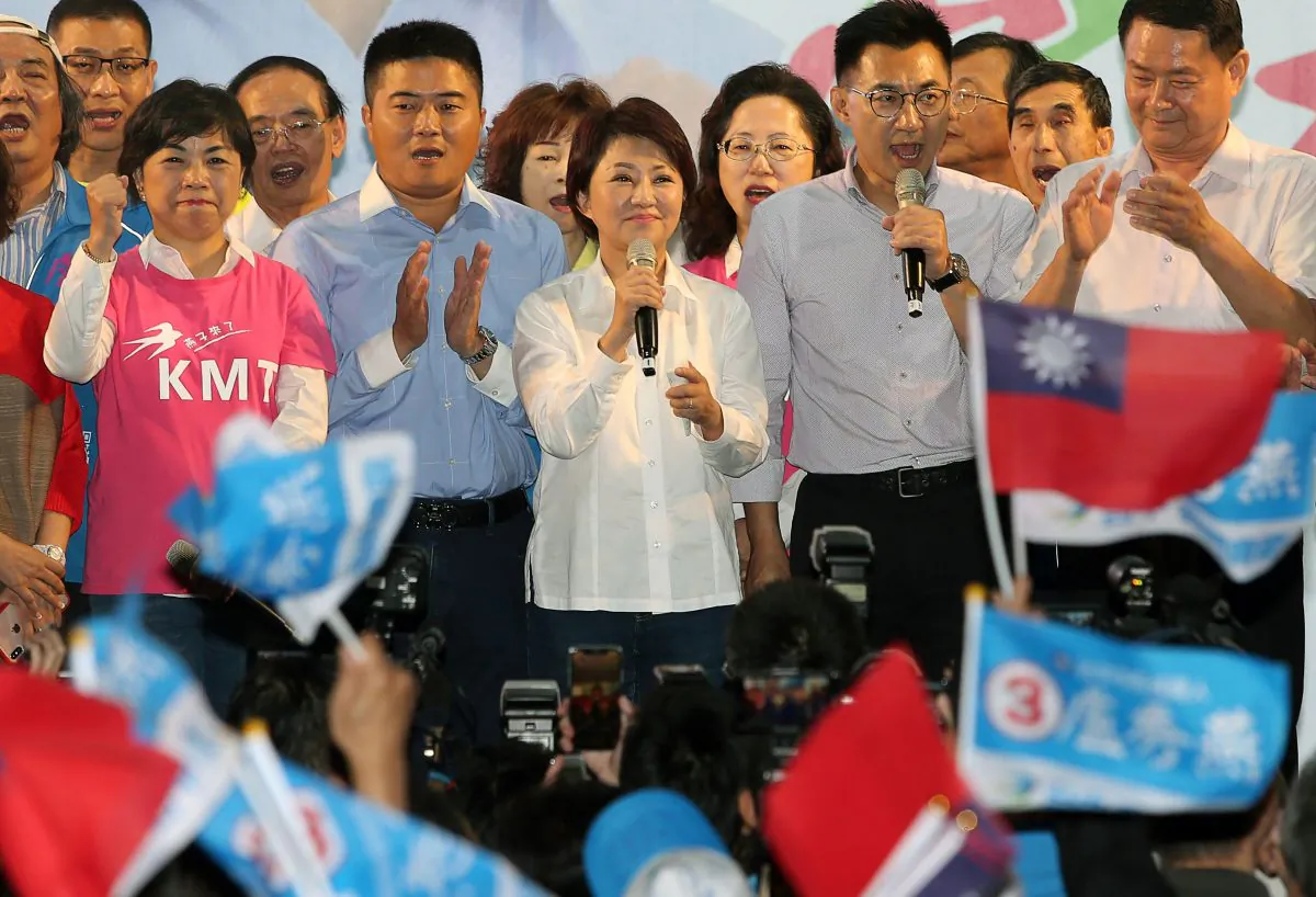 Lu Shiow-yen (C), from the main opposition Kuomintang (KMT) party, speaks after his victory in the Taichung mayor race following local elections in Taipei on Nov. 24, 2018. (AFP/Getty Images)