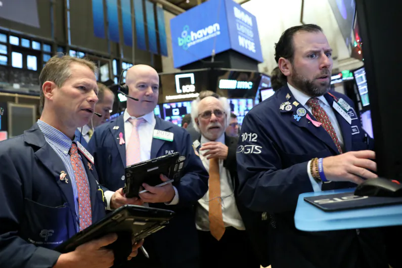 Traders work on the floor at the New York Stock Exchange (NYSE) in New York City, on Nov. 26, 2018. (Brendan McDermid/Reuters)