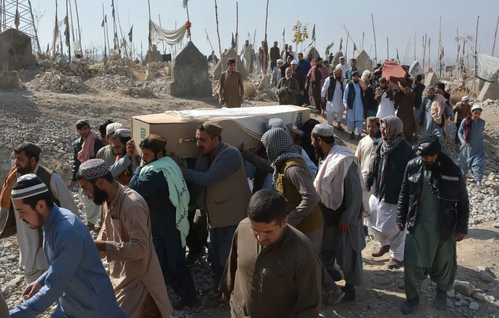 Pakistani mourners carry the coffins of victims who were killed in an attack at the Chinese Consulate, during a funeral ceremony in Quetta on Nov. 24, 2018. (Banaras Khan/AFP/Getty Images)