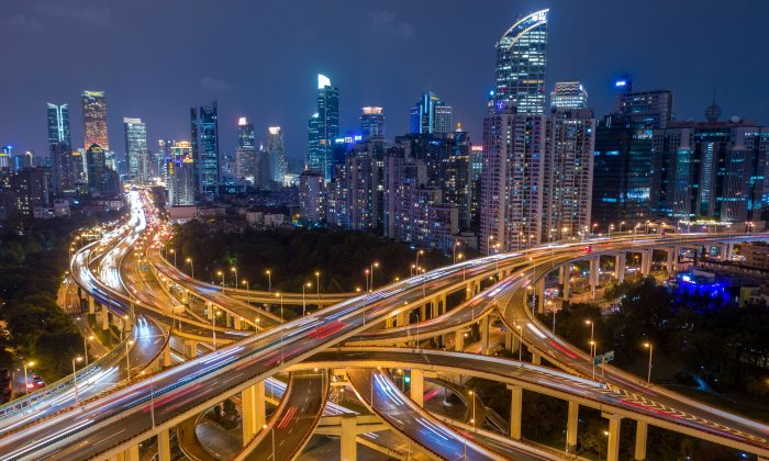 This aerial picture shows traffic on an elevated intersection in downtown Shanghai, China on Nov. 12, 2018. (Johannes Eisele/AFP/Getty Images)