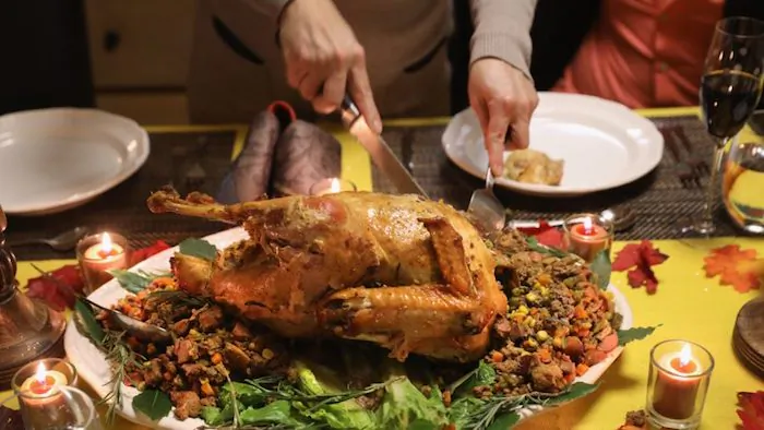 A family enjoys Thanksgiving turkey in a file photo. (John Moore/Getty Images)