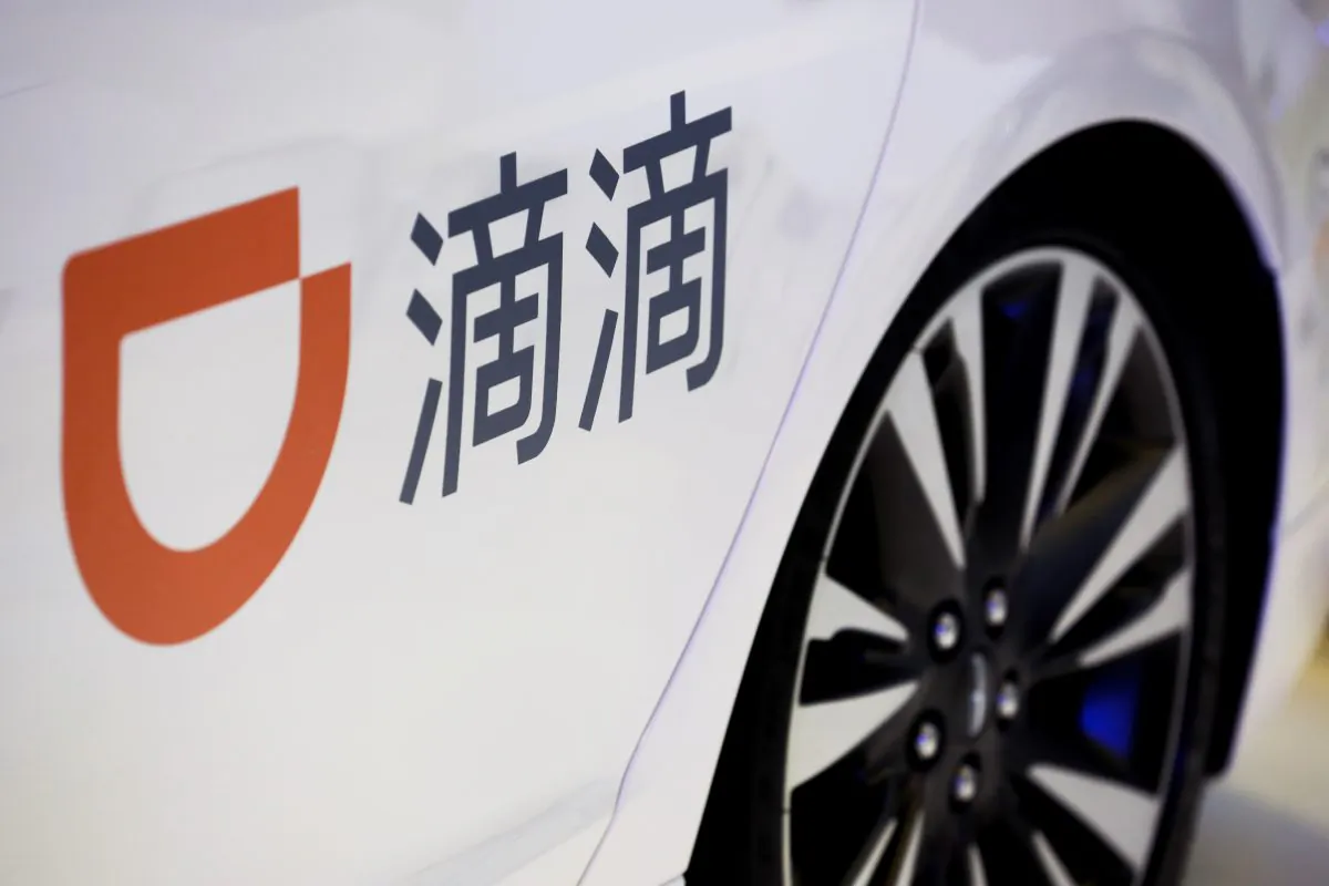 The company logo of the Didi ride hailing app is seen on a car door at the IEEV New Energy Vehicles Exhibition in Beijing on Oct. 18, 2018. (Thomas Peter/Reuters)