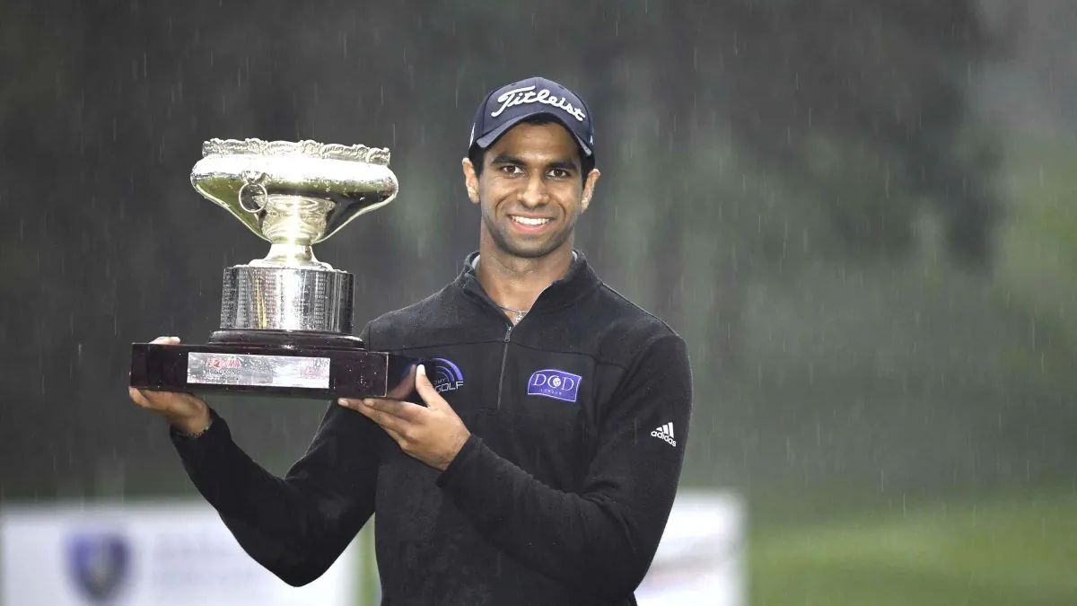 Aaron Rai of England displays the Hong Kong Open trophy after winning a wire-to-wire victory, his first European Tour win, just holding off Matthew Fitzpatrick also of England by a single stroke at Fanling Golf Club on Sunday Nov 25. (Bill Cox).