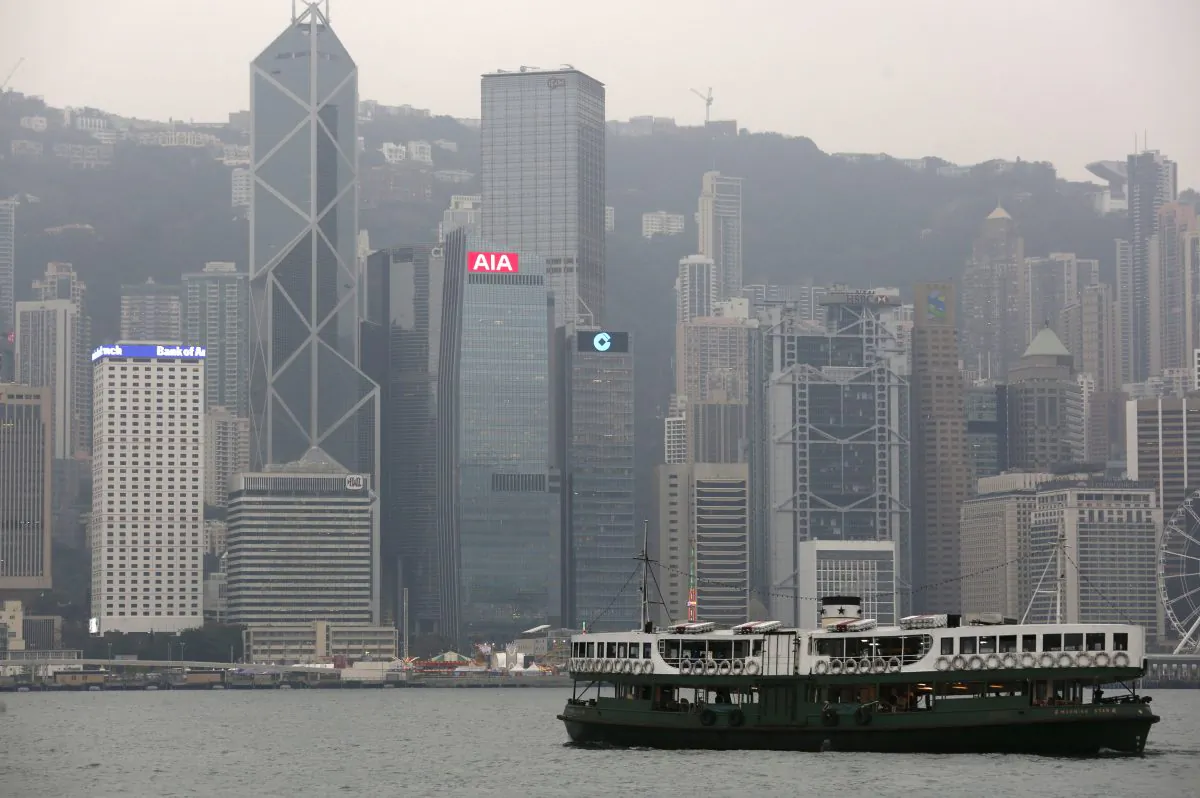 A ferry sails at Victoria Harbour in front of the financial central district in Hong Kong on Feb. 17, 2016. (Bobby Yip/Reuters)