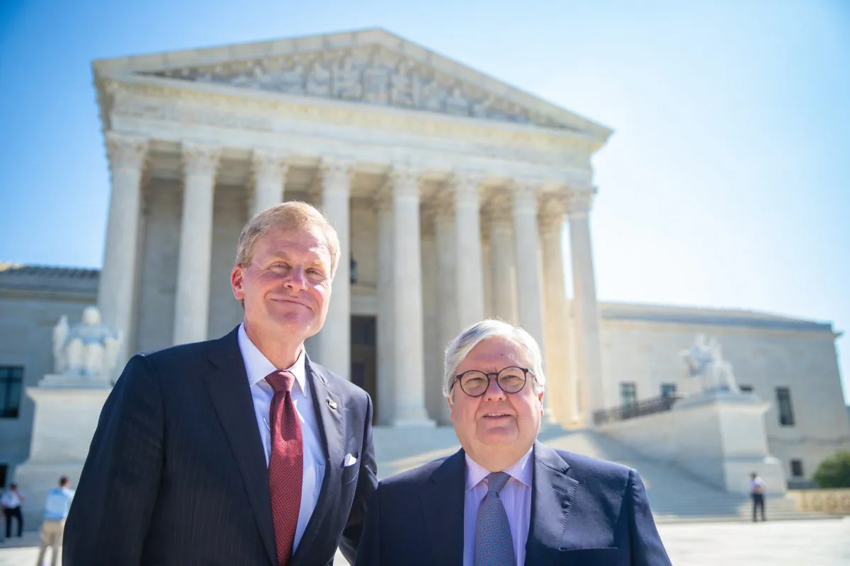 Attorney Mark Miller of the Pacific Legal Foundation and Edward Poitevent, plaintiff in Weyerhaeuser Co. v. U.S. Fish and Wildlife Service, stand outside the Supreme Court in Washington on Nov. 27, 2018. (Pacific Legal Foundation)