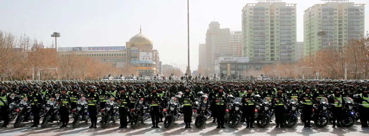 Chinese police attend an anti-terrorist oath-taking rally in Hetian, in northwest China's Xinjiang Uighur Autonomous Region on Feb. 27, 2017. (STR/AFP/Getty Images)