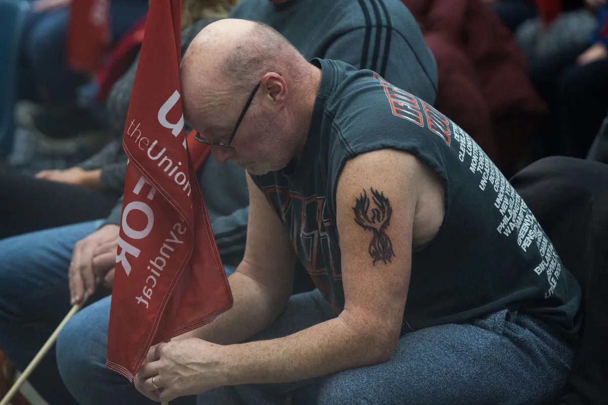 Carl Dillmam, who has worked at the General Motors plant for 37 years sits with union members in Oshawa, Ontario, on Nov. 26, 2018. (Lars Hagberg/AFP/Getty Images)
