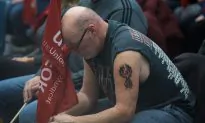 Emotional General Motors Workers Seen Wiping Away Tears After Company Lays Off 14,500 People