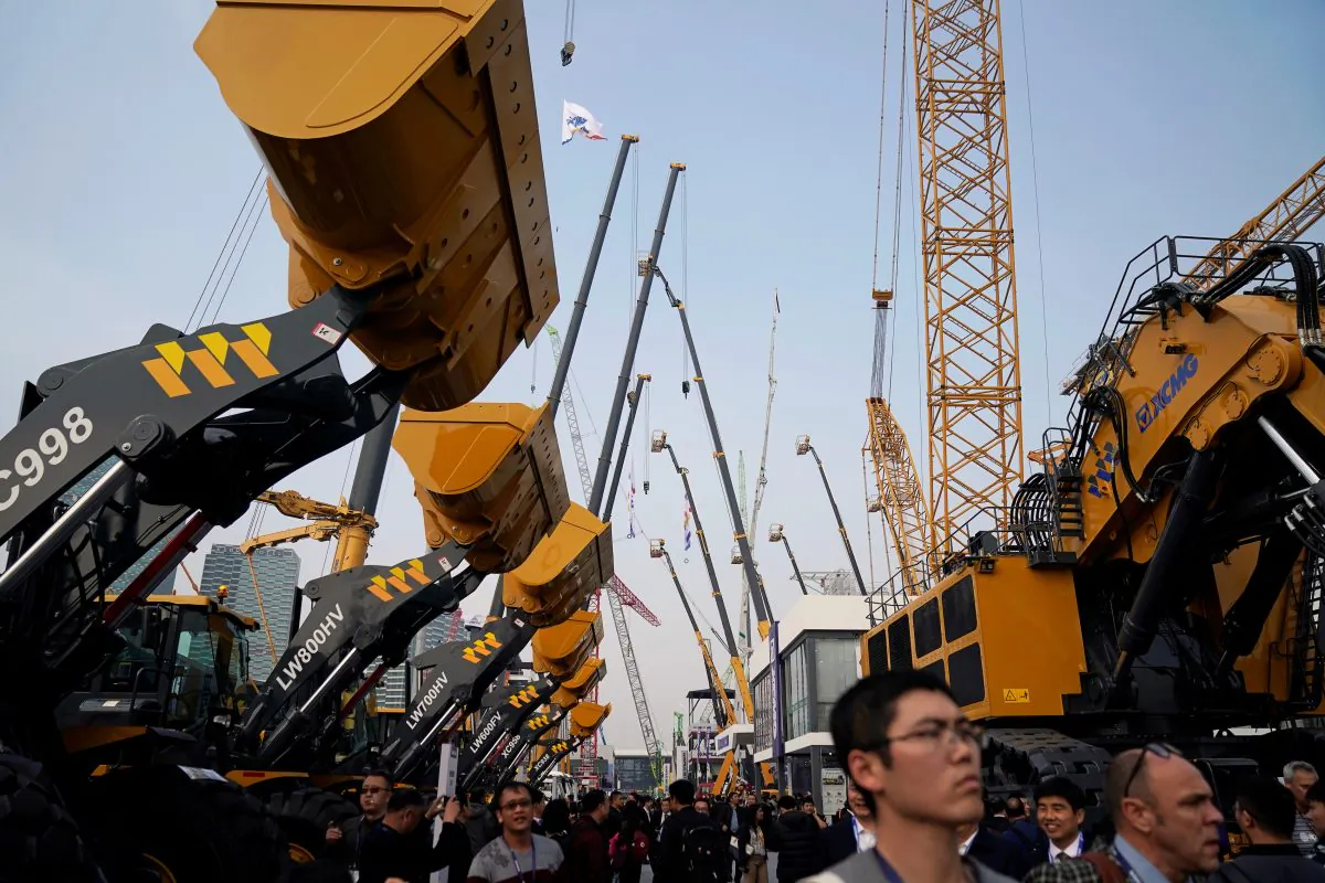 People visit heavy machinery at Bauma China, the International Trade Fair for Construction Machinery in Shanghai, China  on Nov. 27, 2018. (Aly Song/Reuters)