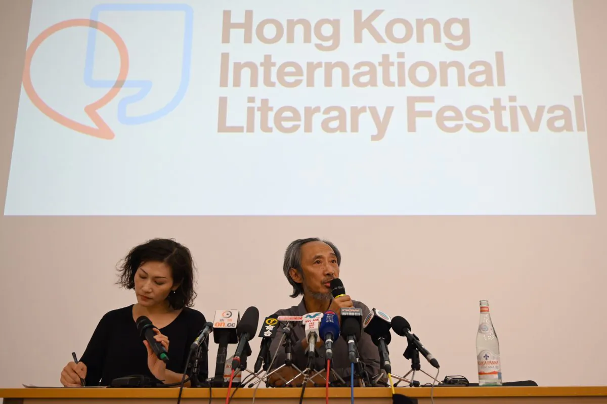 Dissident Chinese author Ma Jian (R) speaks during a press conference at the new Tai Kwun arts centre in Hong Kong on Nov. 10, 2018, which hosts the Hong Kong International Literary Festival and had originally cancelled his talks under pressure from Beijing. (Anthony Wallace/AFP/Getty Images)
