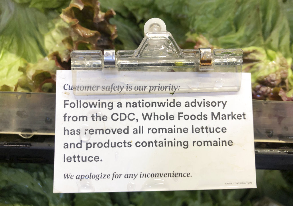 A sign is posted about romaine lettuce at a Whole Foods Market in Jenkintown, Pa., on Nov. 28, 2018. (AP Photo/Matt Rourke)