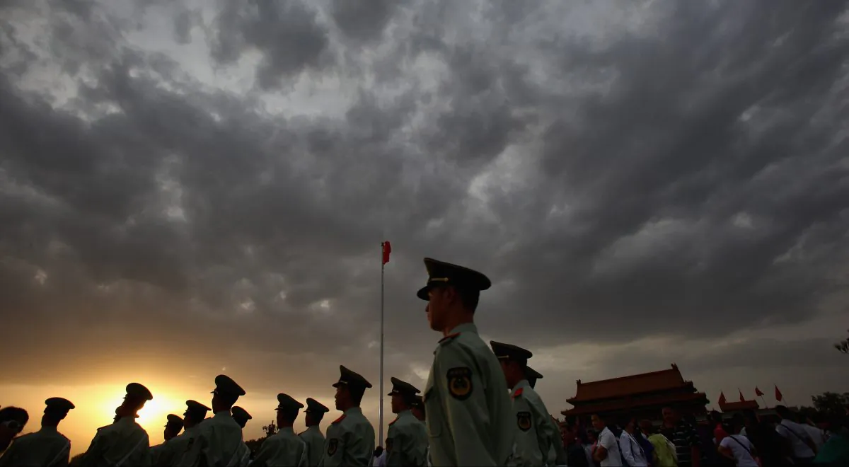 Paramilitary policemen patrol Tiananmen Square outside the Forbidden City in Beijing, on May 18, 2011. (Feng Li/Getty Images)