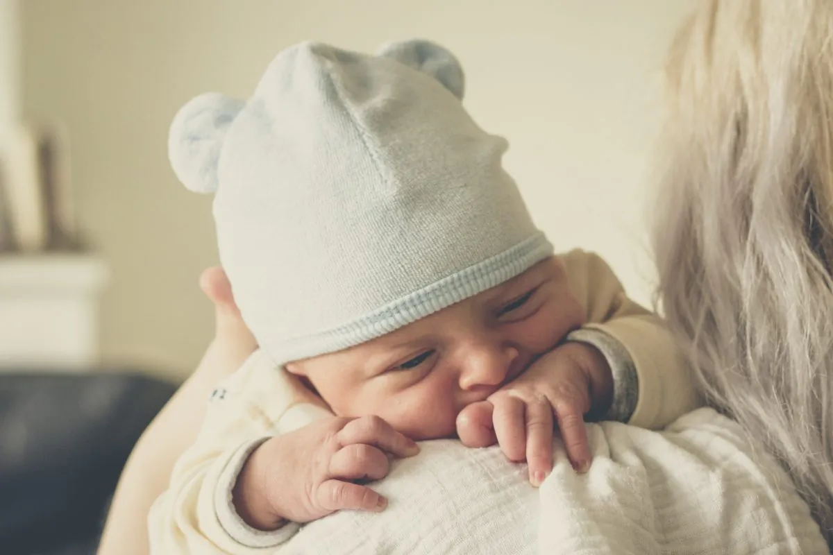 An undated stock photo of a mother holding a baby. (Echo Grid/Unsplash)