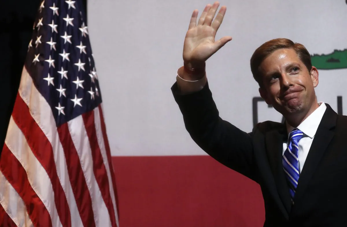 Democratic congressional candidate Mike Levin (Calif.-49) waves at a 2018 mid-term elections rally on Oct. 4, 2018, in Fullerton, California. Levin went on to win the seat. (Mario Tama/Getty Images)