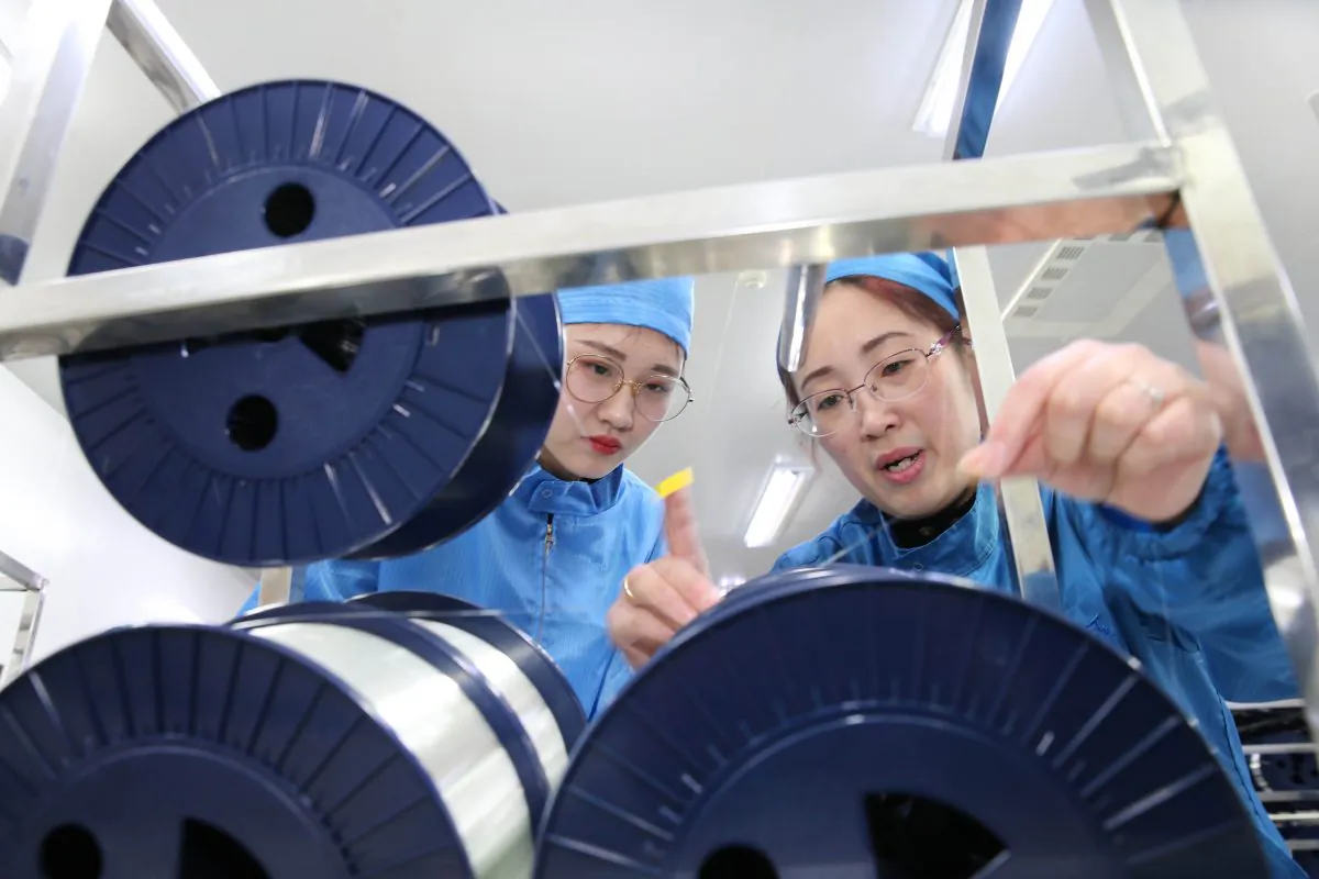 Staff work in a fibre-optic cable factory in Nantong City, Jiangsu Province, on Nov. 27, 2018. (AFP/Getty Images)