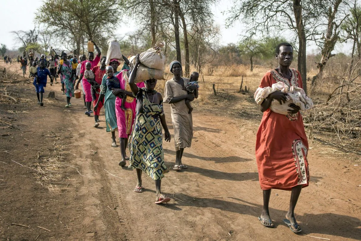 People walk for hours to reach a food distribution site in Malualkuel in the Northern Bahr el Ghazal region of South Sudan, on April 5, 2017. (AP Photo, File)