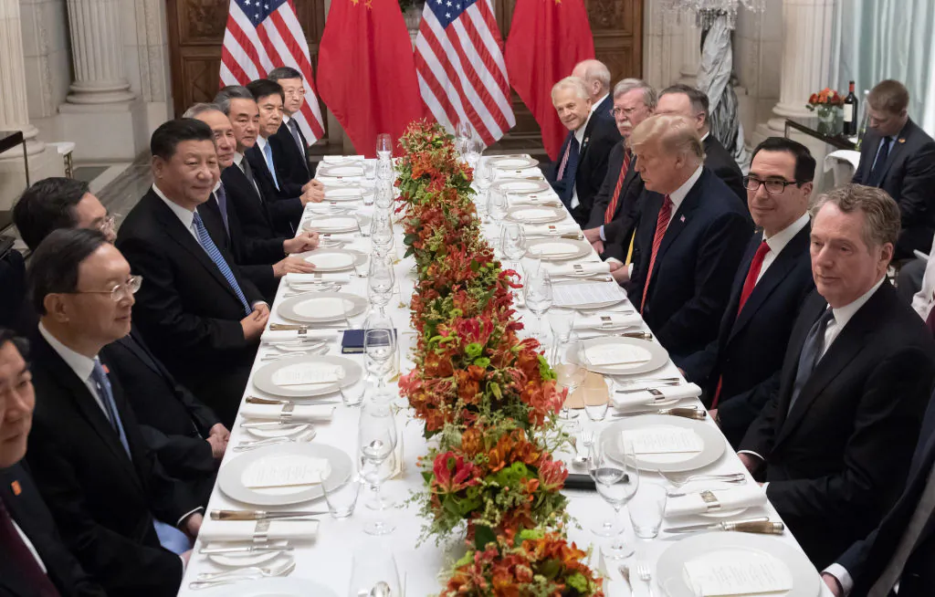 US President Donald Trump (C-R) and Chinese leader Xi Jinping (C-L) along with members of their delegations, hold a dinner meeting at the end of the G20 Leaders' Summit in Buenos Aires, on Dec. 01, 2018. (Saul Loeb/AFP/Getty Images)