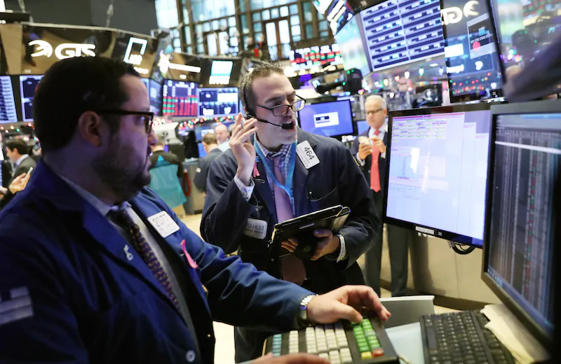 Traders work on the floor at the New York Stock Exchange (NYSE) in New York City, on Nov. 30, 2018. (Brendan McDermid/Reuters)