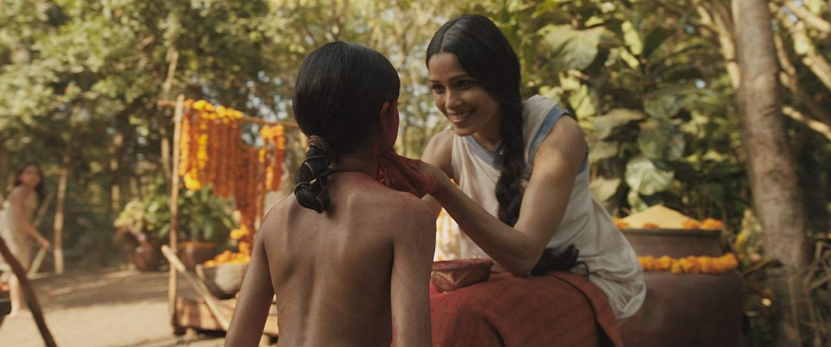 (L-R) Rohan Chand and Freida Pinto greet