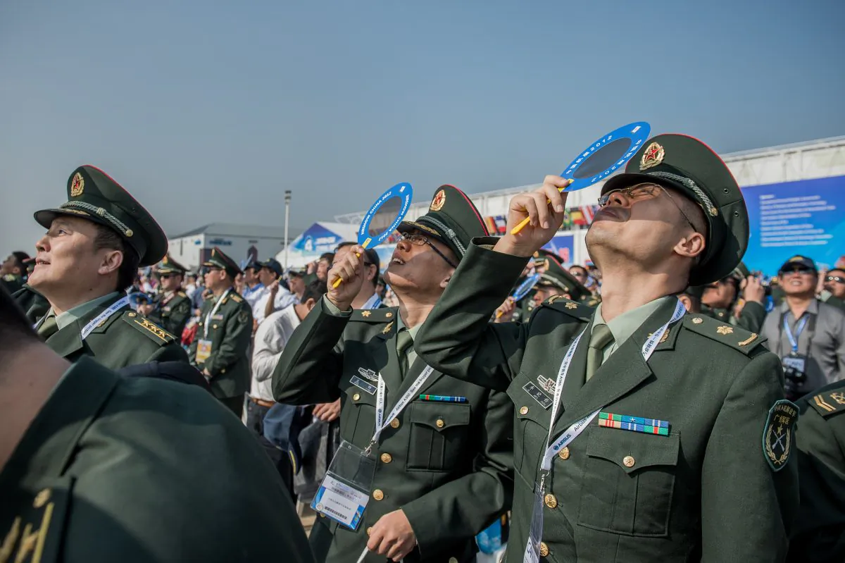 Officers of China's People Liberation Army watch an aerial display at Airshow China in Zhuhai, China, on Nov. 13, 2012. 
(PHILIPPE LOPEZ/AFP/Getty Images)