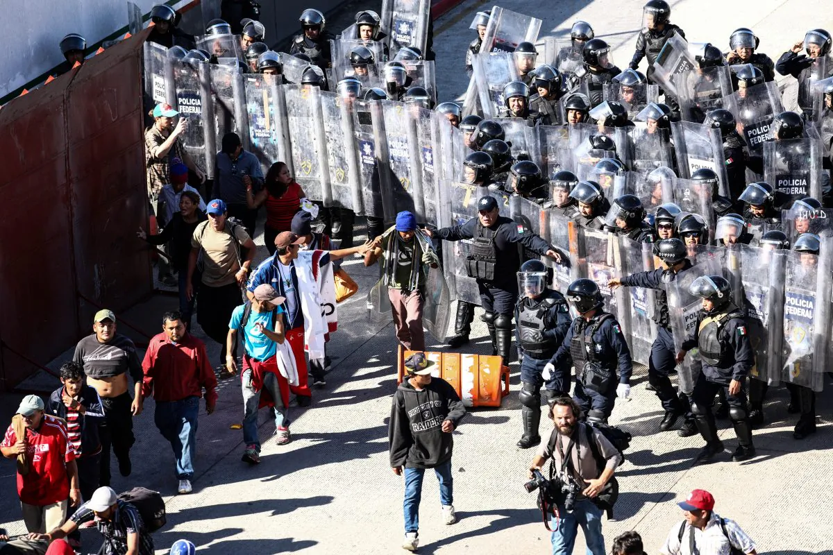 Migrants look for another way to enter the United States, after being turned back by riot police just west of the San Ysidro border crossing in Tijuana, Mexico, on Nov. 25, 2018. (Charlotte Cuthbertson/The Epoch Times)