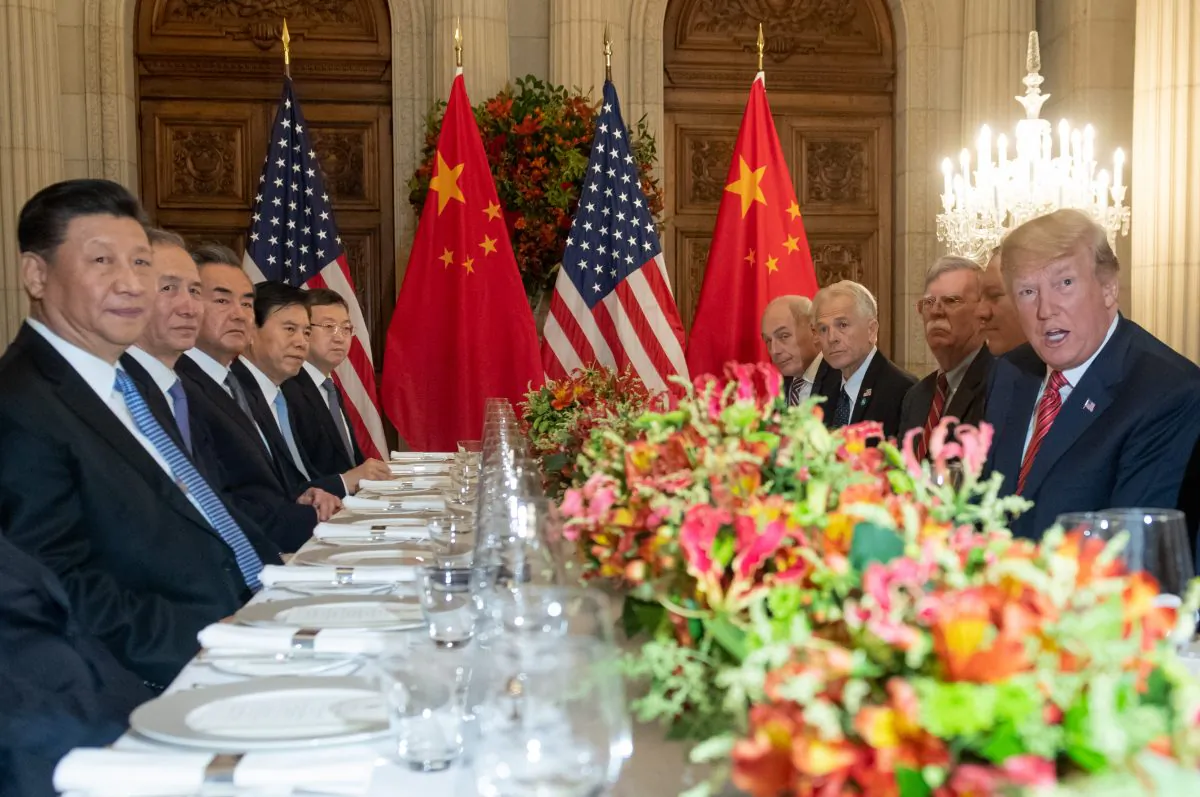 U.S. President Donald Trump (R) and China's President Xi Jinping (L) along with members of their delegations, hold a dinner meeting at the end of the G20 Leaders' Summit in Buenos Aires, on Dec. 1, 2018. (SAUL LOEB/AFP/Getty Images)
