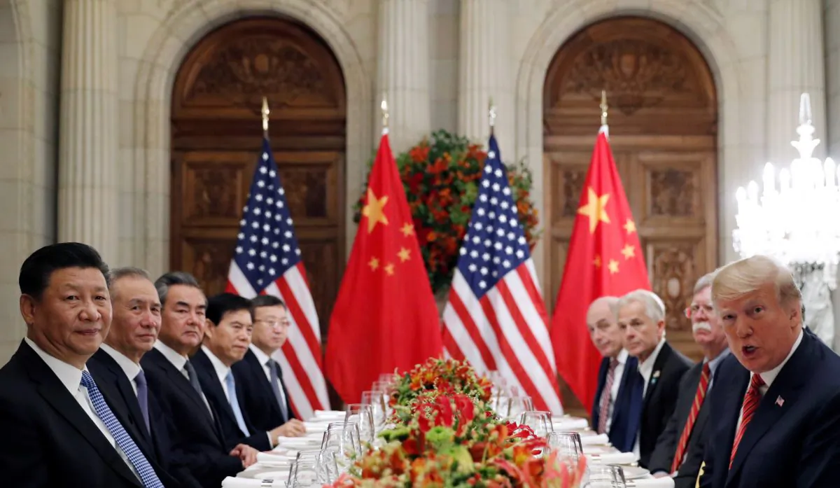 U.S. President Donald Trump, President Trump's national security adviser John Bolton, President Trump's trade and manufacturing policy adviser Peter Navarro and others, as well as Chinese leader Xi Jinping's leadership team attend a working dinner after the G-20 leaders summit in Buenos Aires, Argentina, on Dec. 1, 2018. (Kevin Lamarque/Reuters)