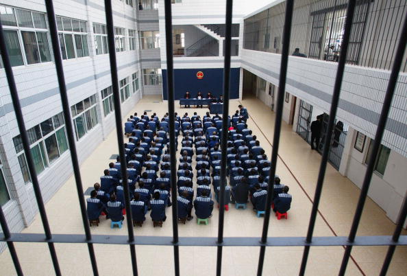 Prisoners attend a commutation sentence at the Hongshan Prison in Hubei Province on Dec. 10, 2004. (China Photos/GettyImages)