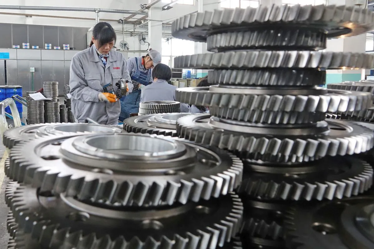 Workers inspect engine gears at a company under Dongbei Special Steel Group in Yantai, Shandong Province, China on Nov. 29, 2018. (Reuters)