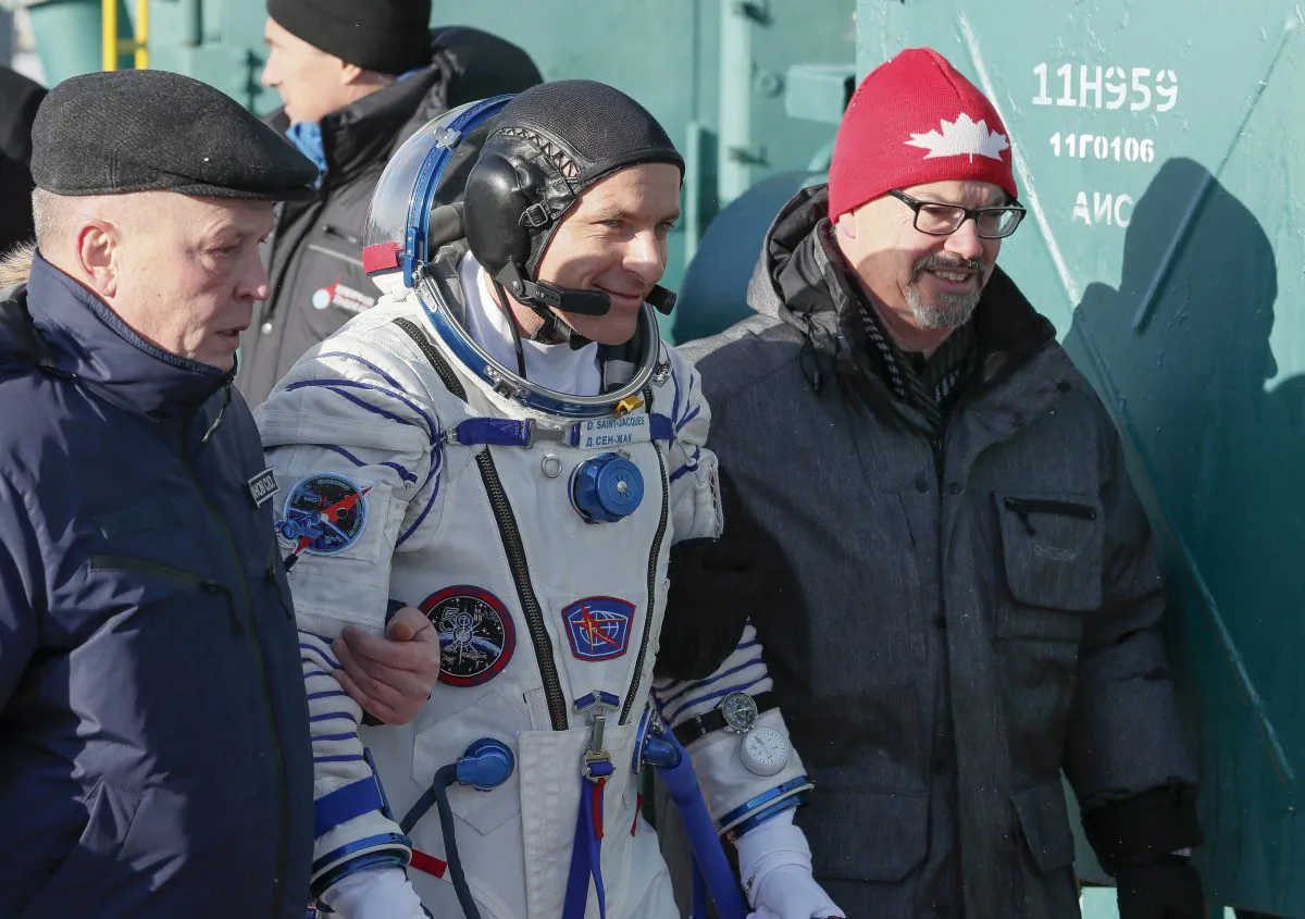 CSA astronaut David Saint Jacques walks to the rocket prior to the launch of Soyuz-FG rocket at the Russian leased Baikonur cosmodrome, Kazakhstan on Dec. 3, 2018. (AP Photo/Shamil Zhumatov, Pool)
