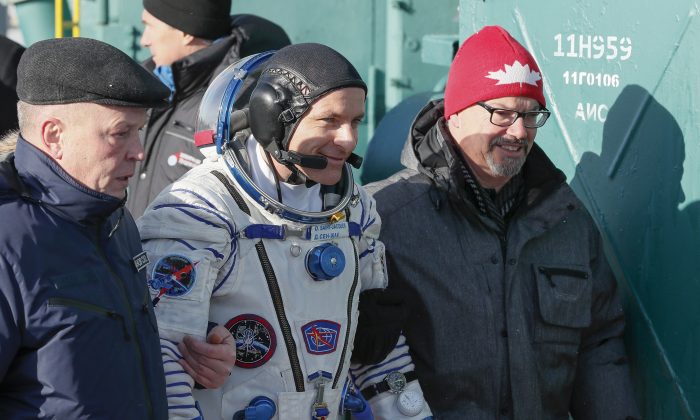 CSA astronaut David Saint Jacques walks to the rocket prior to the launch of Soyuz-FG rocket at the Russian leased Baikonur cosmodrome, Kazakhstan on Dec. 3, 2018. (AP Photo/Shamil Zhumatov, Pool)