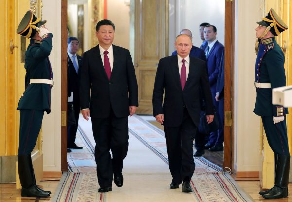 Russian President Vladimir Putin (2-R) and Chinese President Xi Jinping (2-L) at the Kremlin in Moscow