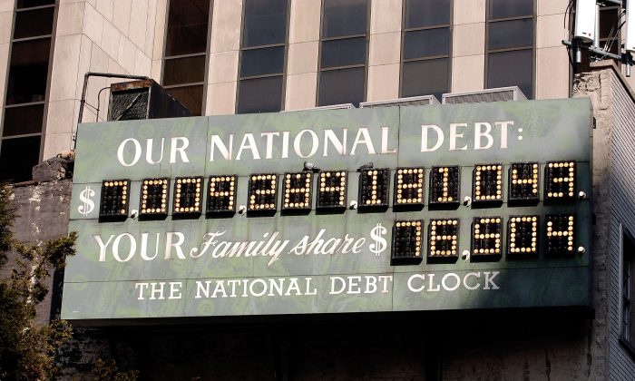 The National Debt Clock is seen in New York City on Feb. 19, 2004. As of July 31, 2018, the national debt stood at $15.6 trillion. (Stephen Chernin/Getty Images)