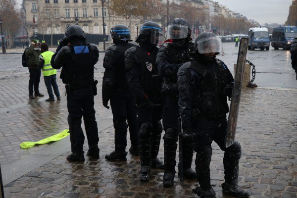 Riot police stand guard in Place de l'Etoile in Paris.