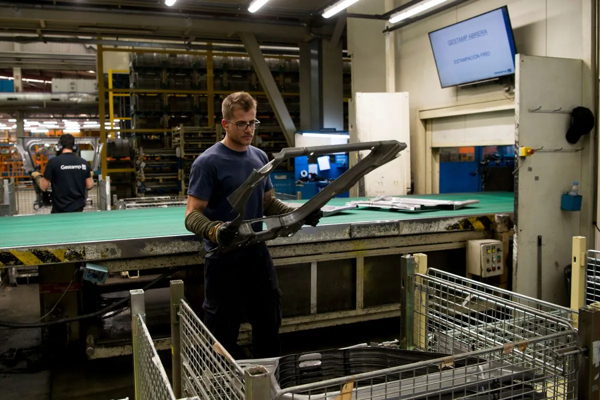 An operator works on processed metal at the Gestamp Automocion factory branch in Abrera, near Barcelona, on June 19, 2018. (Josep Lago/AFP/Getty Images)