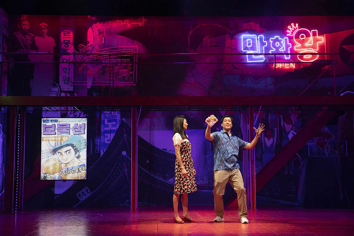 Nanhee (Michelle Krusiec), a defector from North Korea, and South Korean Minsung (Peter Kim), a lonely “goose father” whose family has moved to America, meet via the internet. (Joan Marcus)