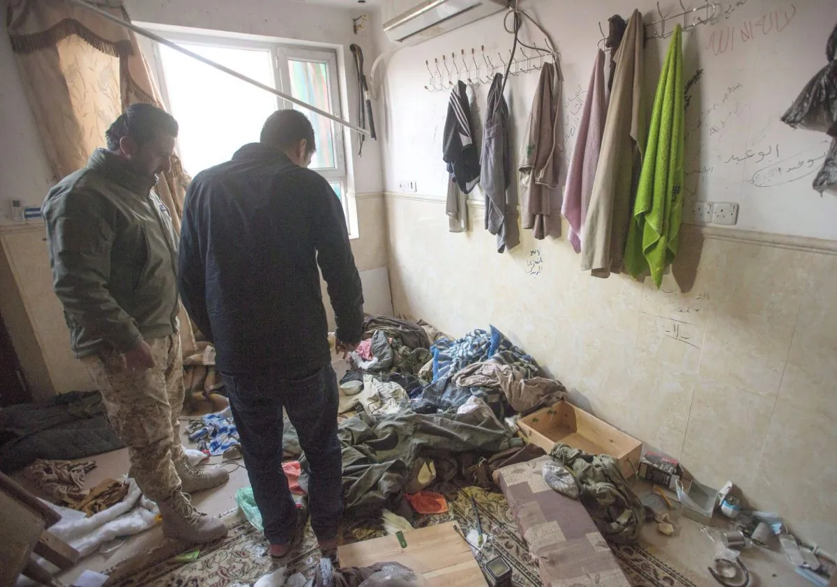 A member of the Asaish Kurdish security force shows a reporter the inside of a house occupied by ISIS terrorists, on Feb. 23, 2017, in Bashiqa, Iraq. (The Canadian Press/Ryan Remiorz)