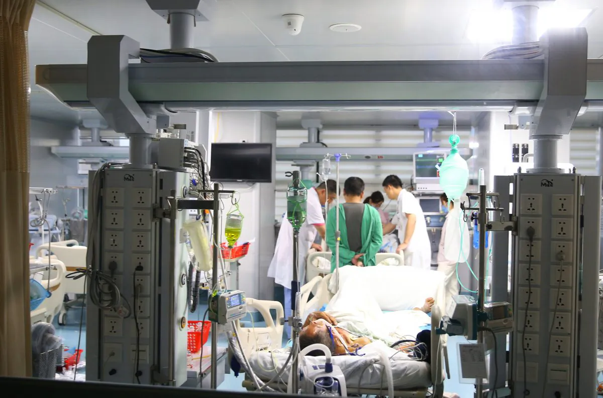 An injured person (front C) receives medical treatment in a hospital after a road accident which left 18 people dead and 14 injured, in Hengyang in China's central Hunan province on June 30, 2018. (AFP/Getty Images)