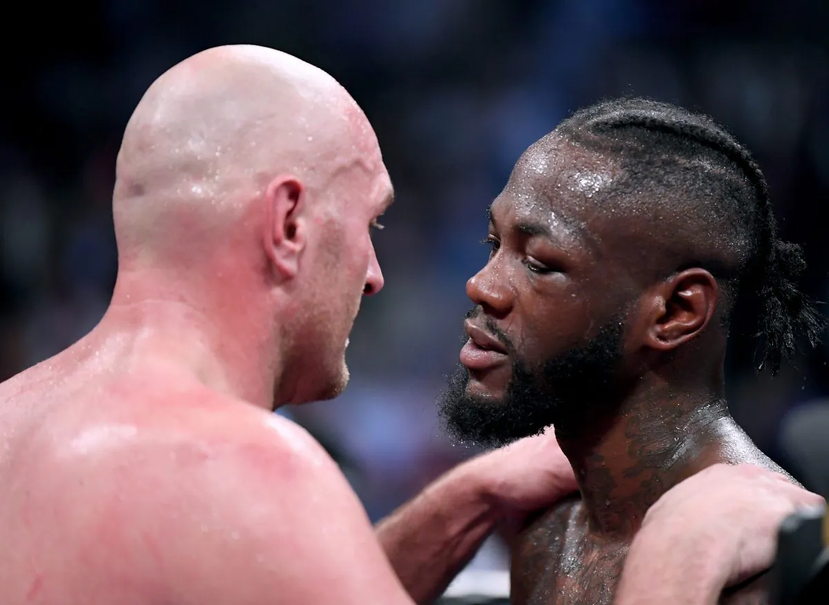 Tyson Fury embraces Deontay Wilder after fighting to a draw during the WBC Heavyweight Championship at the Staples Center, on Dec. 1, 2018 in Los Angeles. (Harry How/Getty Images)