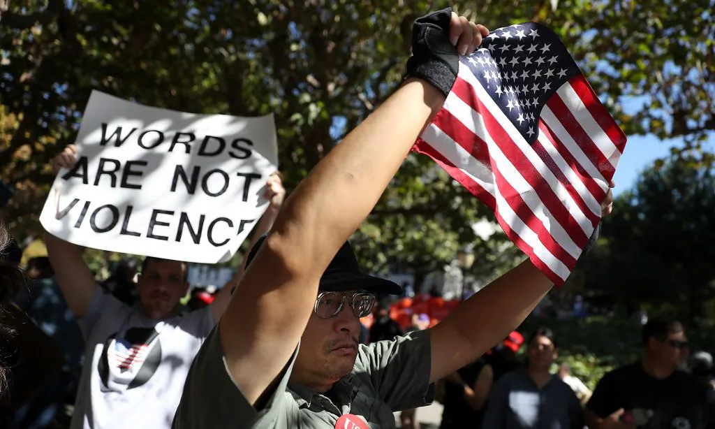 Anna Budd, of Oakland, who describes herself as "a classic liberal" holds a sign saying "Open Dialogue Not Heads" at a conservative rally on Apr. 27, 2017 in Berkeley, Calif. (Elijah Nouvelage/Getty Images)