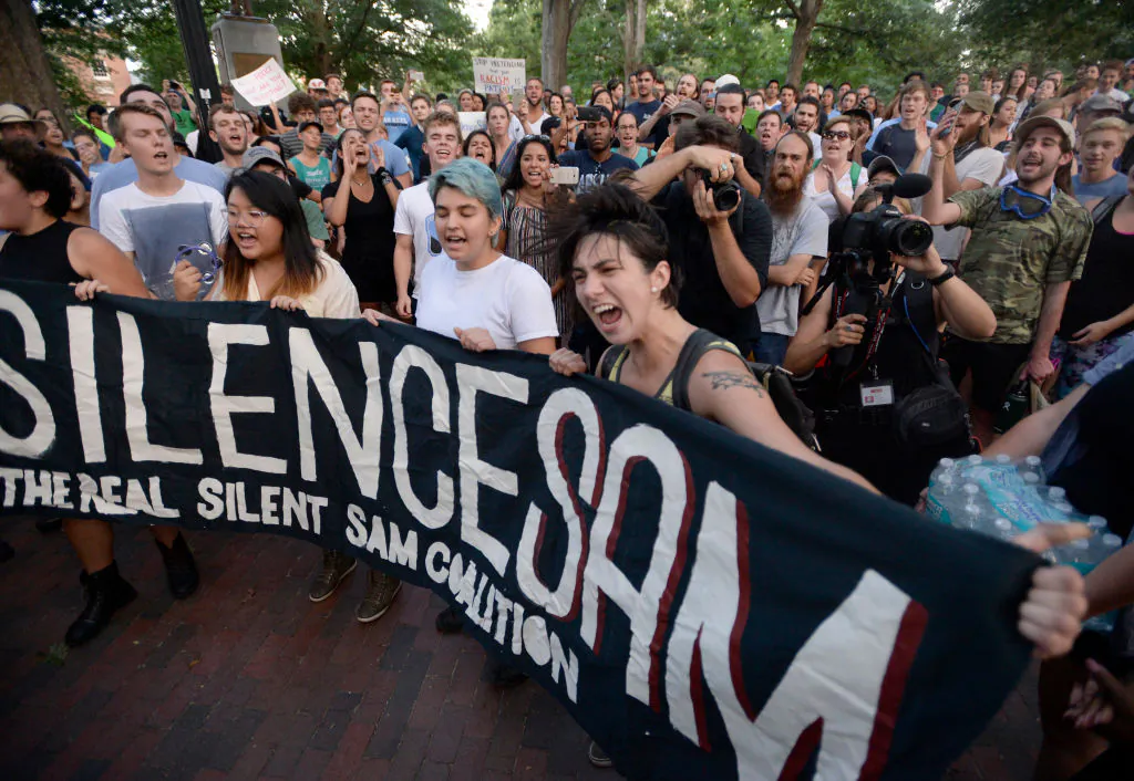 Demonstrators call for the removal of a Confederate statue, coined Silent Sam, on the campus of the University of North Carolia at Chapel Hill, in Chapel Hill, N.C., on Aug. 22, 2017. (Sara D. Davis/Getty Images)
