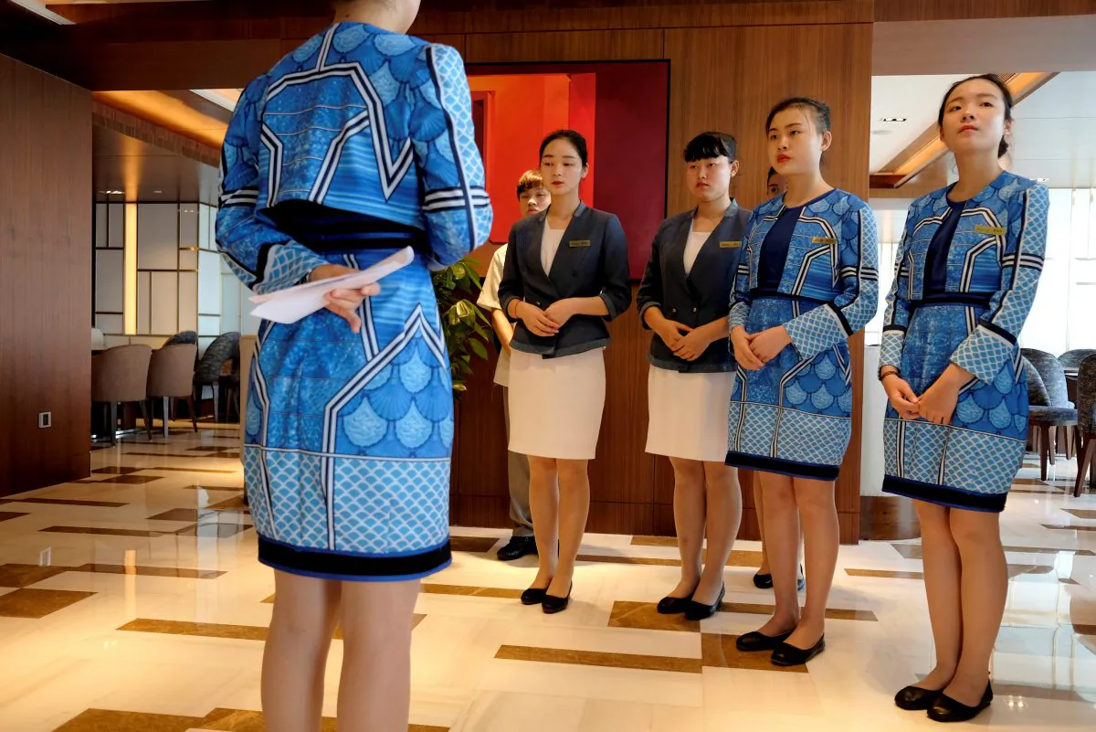 Attendants are trained at the executive lounge of Atlantis Sanya hotel in Sanya, Hainan Province, China on April 28, 2018. (Bobby Yip/Reuters)