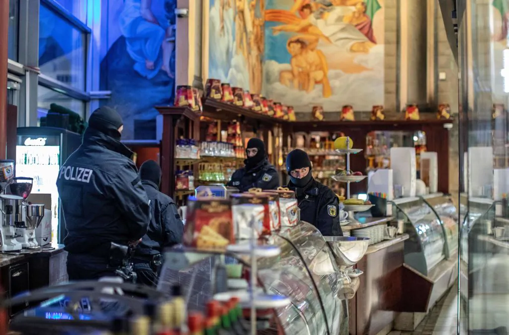 Policemen raid an ice cafe in Duisburg, western Germany, on Dec. 5, 2018. (CHRISTOPH REICHWEIN/AFP/Getty Images)