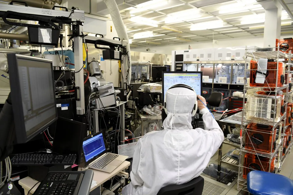 An engineer works in the clean room facilities at the LETI, a French research institute for electronics and information technologies founded by the French Alternative Energies and Atomic Energy Commission (CEA). (JEAN-PIERRE CLATOT/AFP/Getty Images)