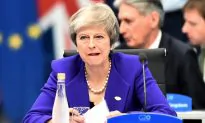 UK PM May’s Party Opposes Her Brexit Deal as Economy Slows