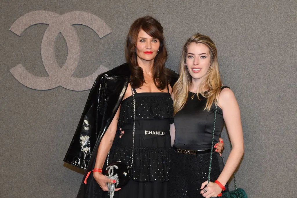 Danish model Helena Christensen and guest at the Chanel Metiers D'Art 2018/19 Show at The Metropolitan Museum of Art in New York City on Dec. 4, 2018. (Angela Weiss/AFP/Getty Images)