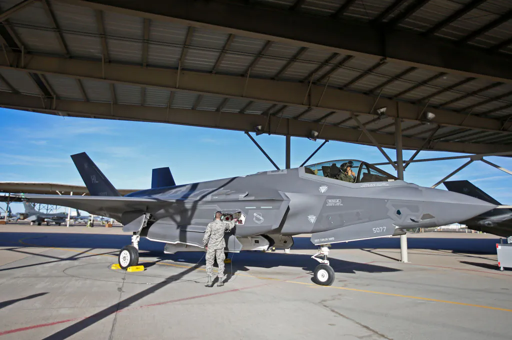 A ground crew member checks out an F-35 plane before a training mission at Hill Air Force Base in Ogden, Utah, on March 15, 2017. (George Frey/Getty Images)