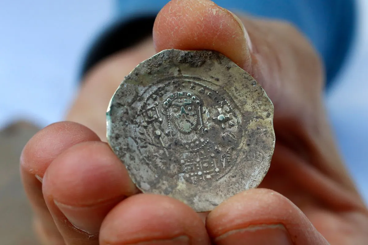 A picture taken on Dec. 3, 2018, shows an ancient gold coin recently uncovered at an excavation site in the Israeli Mediterranean town of Caesarea. (JACK GUEZ/AFP/Getty Images)