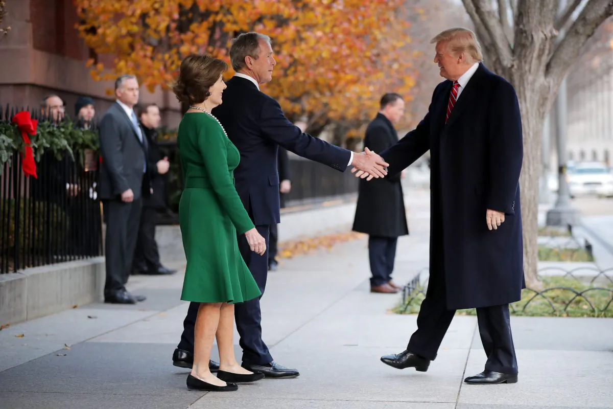 Former First Lady Laura Bush and former President George W. Bush greet President Donald Trump outside of Blair House in Washington on Dec. 4, 2018. (Chip Somodevilla/Getty Images)