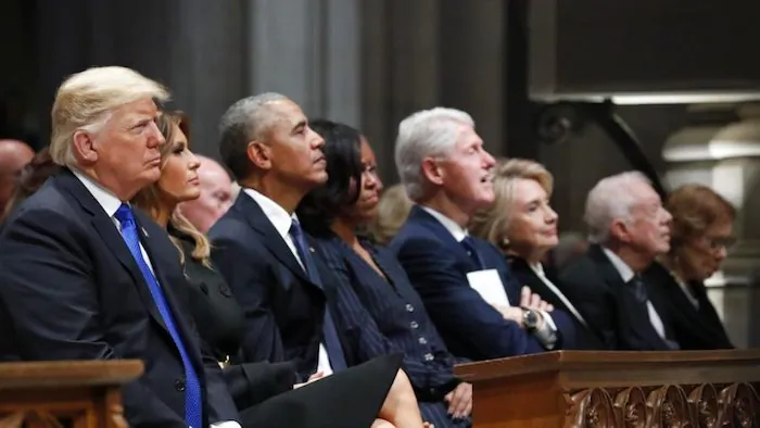 (L-R) President Donald Trump, first lady Melania Trump, former President Barack Obama, former first lady Michelle Obama, former President Bill Clinton, former Secretary of State Hillary Clinton, and former President Jimmy Carter listen as former President George W. Bush speaks during a State Funeral for former President George H.W. Bush at the National Cathedral in Washington on Dec. 5, 2018. (Alex Brandon/AP Pool)